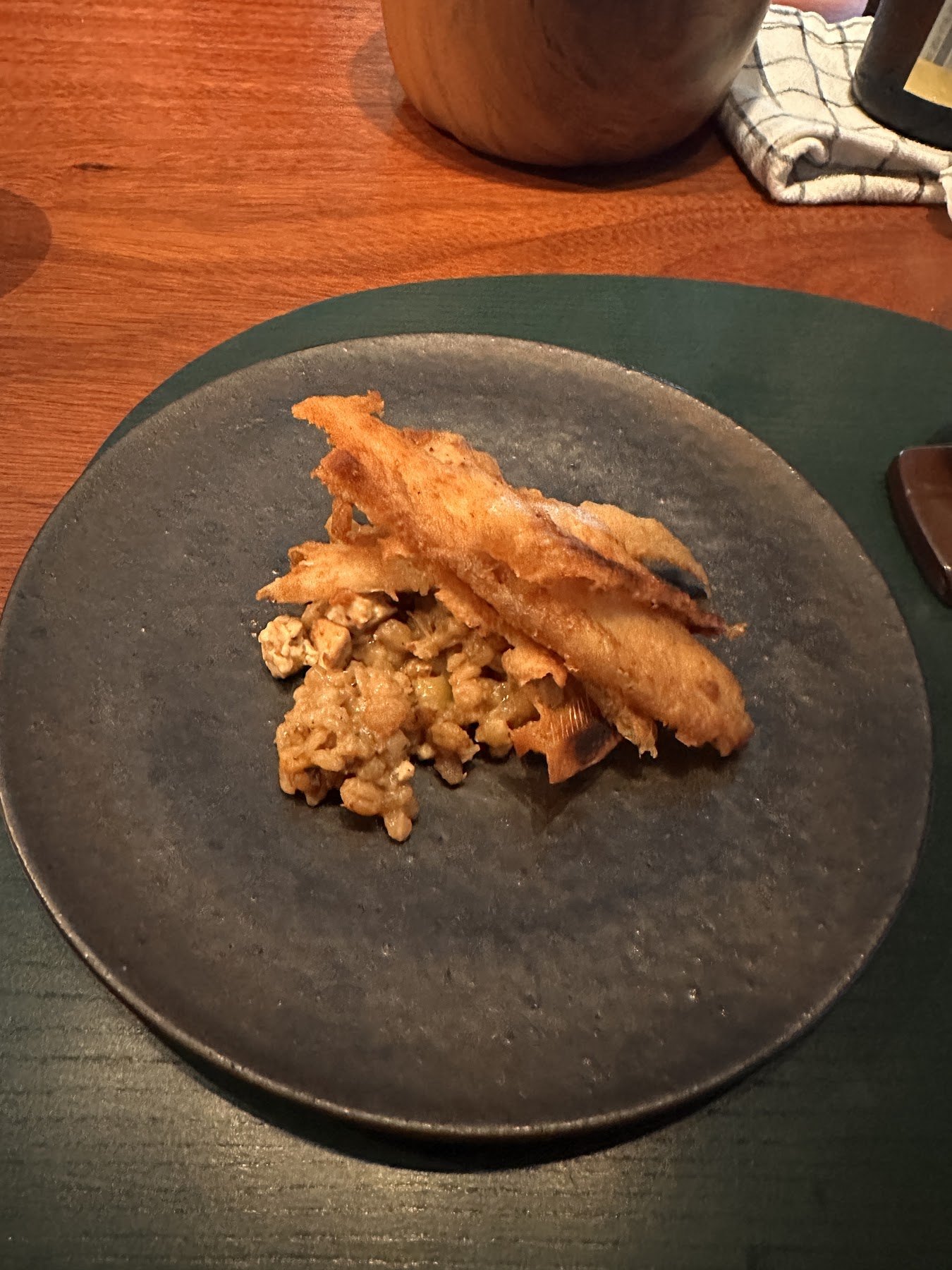 Fried white fish laid over grains
