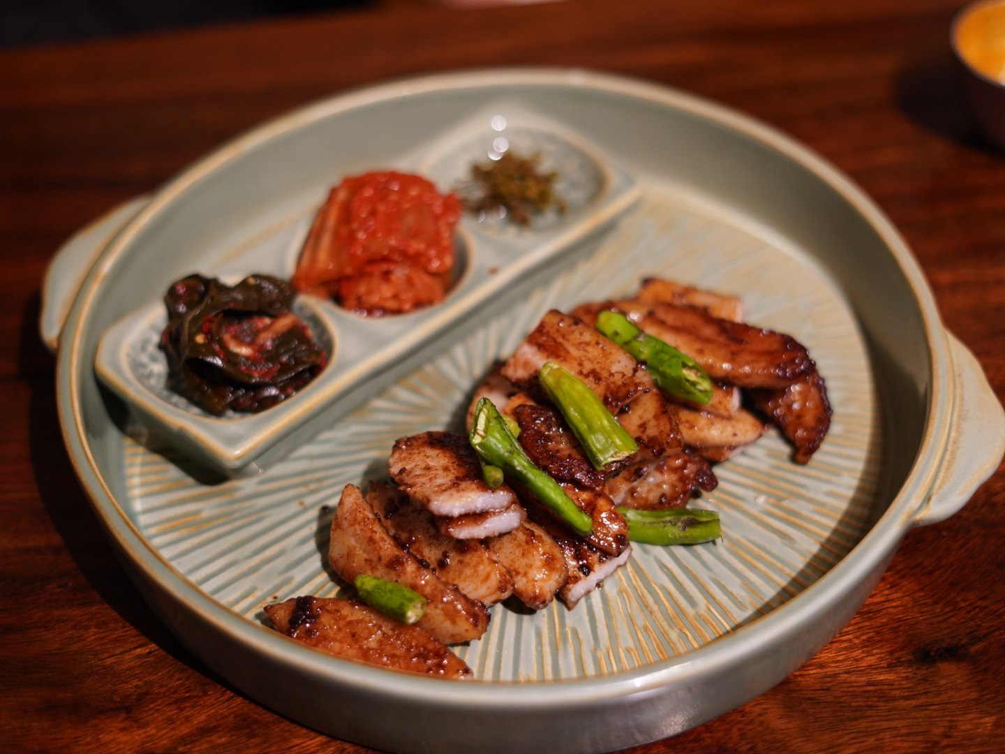 Pork jowl cured in doenjang and grilled, with myeongnan