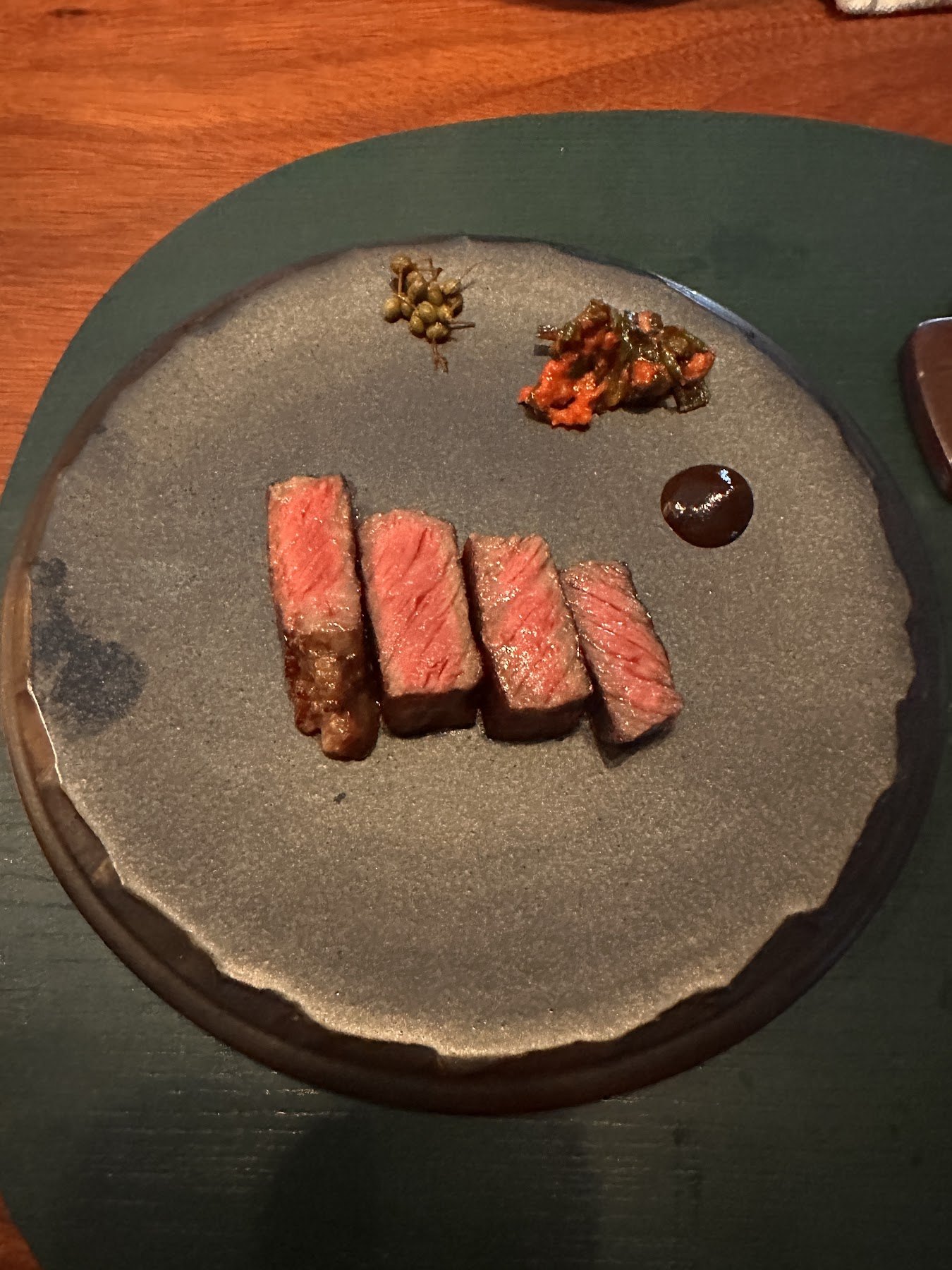 Thinly sliced meat with accompanying sauces