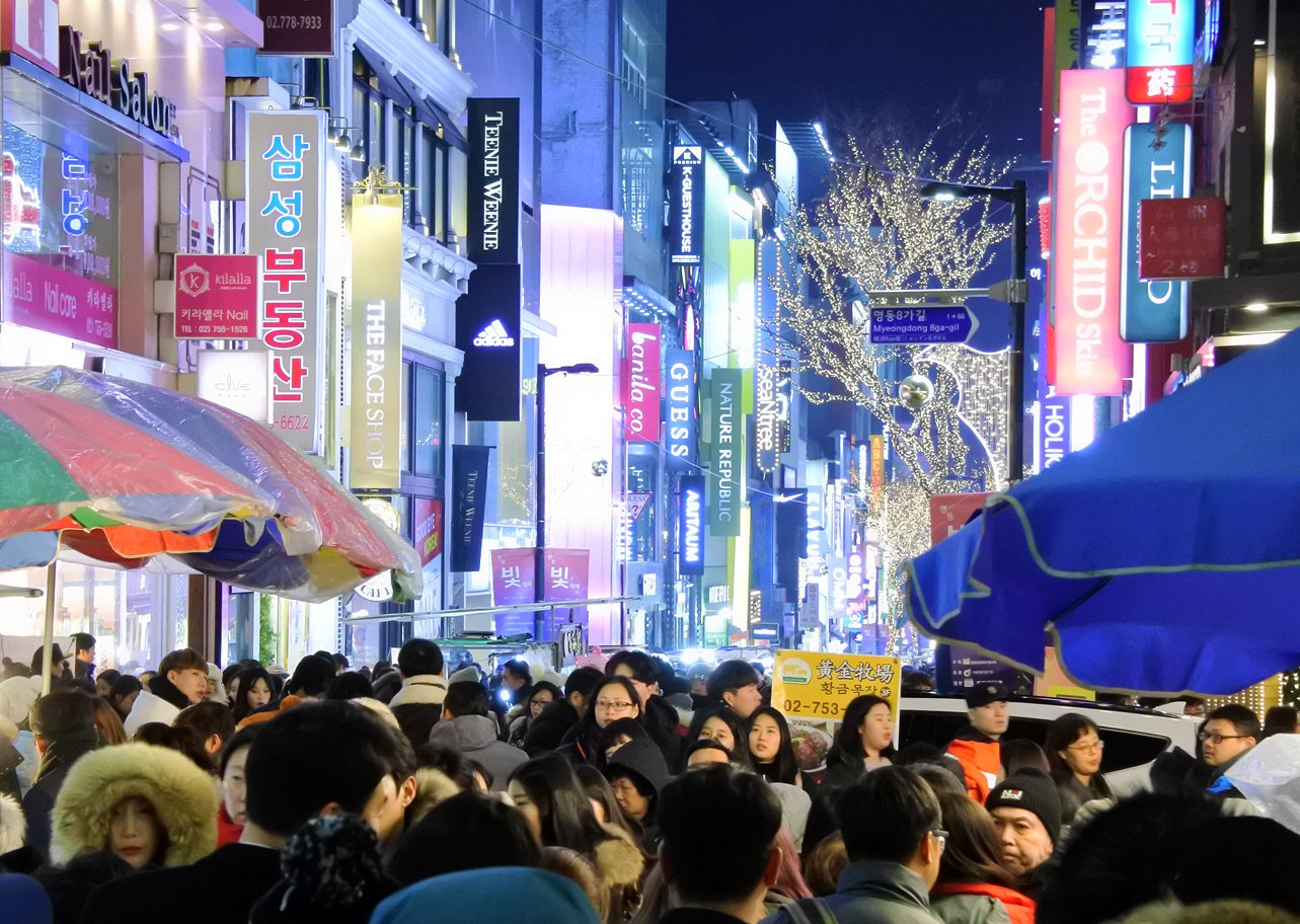 Crowds filling a Myeongdong street on Christmas night