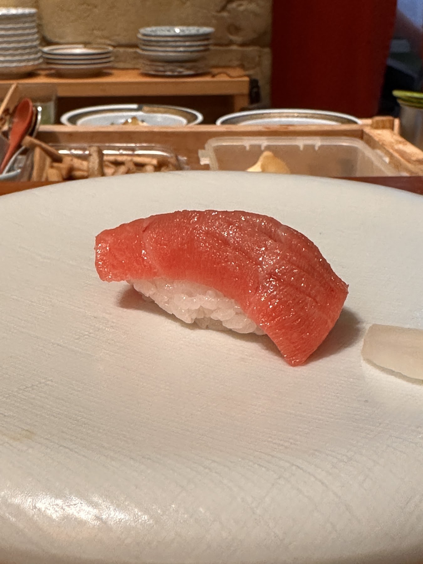 A nigiri topped with lean tuna