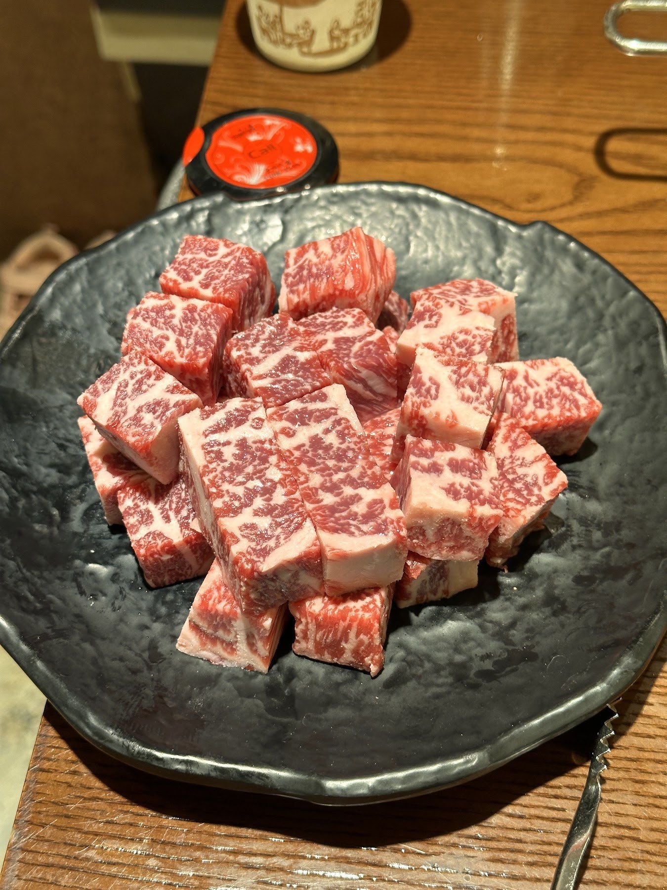 A plate of cube-cut sirloin sliced thick into dice