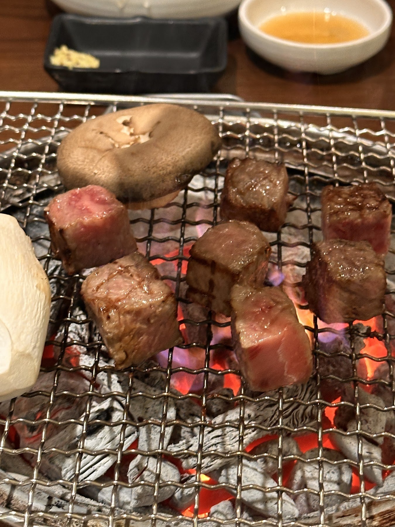 Shiitake on the rack alongside the beef